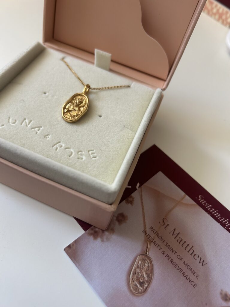 Gold pendant in a gift box